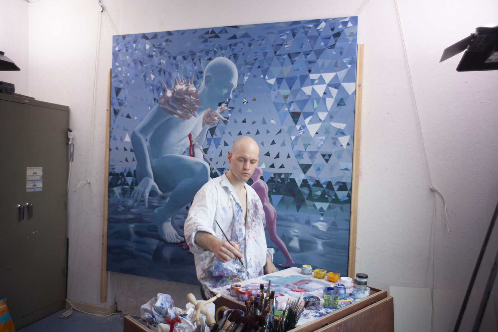 Seppe De Roo painting in his atelier
